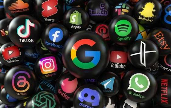 Heap of black spheres each displaying the distinct logo of various popular technology companies and social media platforms
